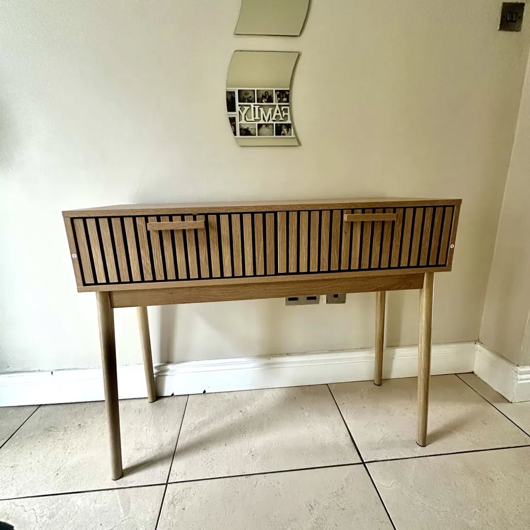 Flat pack console table assembled in a customer's hallway
